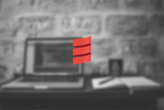 A black and white image of a laptop and a notebook faded and on the middle of the image there is the Scala logo in red for the post 4